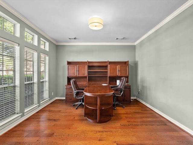 office with crown molding, wood finished floors, and baseboards