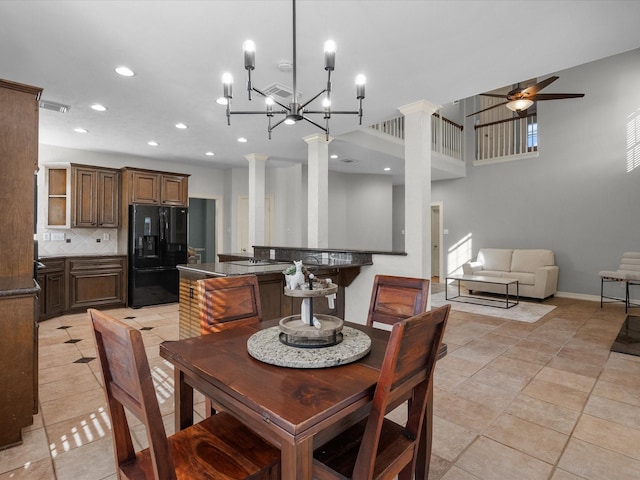 dining area with recessed lighting, ornate columns, light tile patterned flooring, ceiling fan, and a chandelier