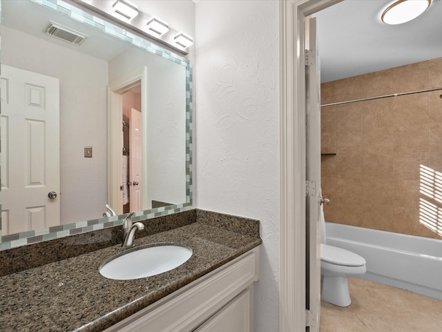 full bath featuring toilet, vanity, tile patterned floors, and tub / shower combination