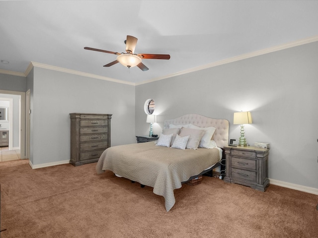 carpeted bedroom with ornamental molding, ceiling fan, and baseboards