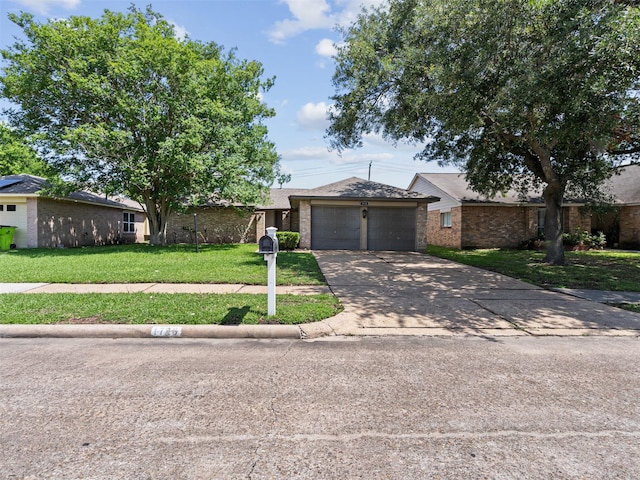 1726 Meadow Green Dr, Missouri City, TX 77489 - view of front of home with a front lawn, driveway, brick siding, and an attached garage