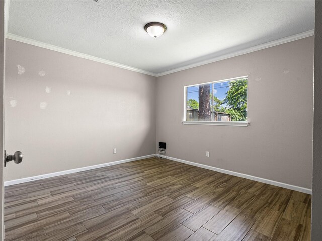 1726 Meadow Green Dr, Missouri City, TX 77489 - unfurnished room with wood finished floors, a textured ceiling, ornamental molding, and baseboards