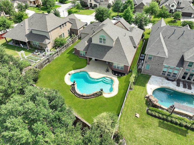 aerial view of residential area with a pool area