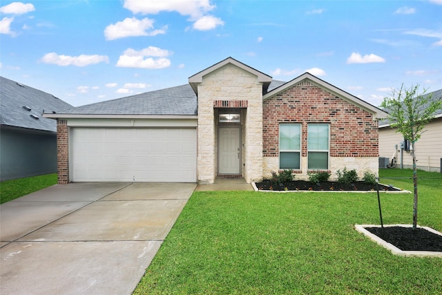 2065 Chief St, Bryan, TX 77807 - view of front of house with concrete driveway, a front lawn, an attached garage, and brick siding