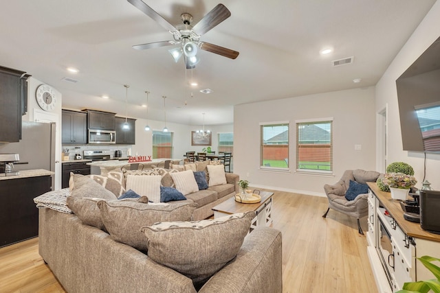 2065 Chief St, Bryan, TX 77807 - living area with light wood-style floors, ceiling fan, and recessed lighting
