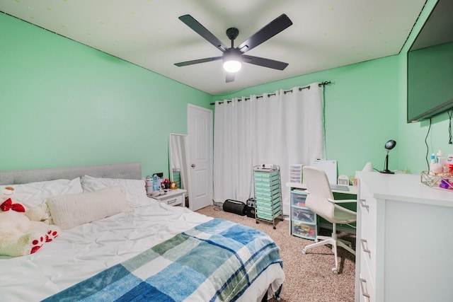2065 Chief St, Bryan, TX 77807 - bedroom with light colored carpet and a ceiling fan