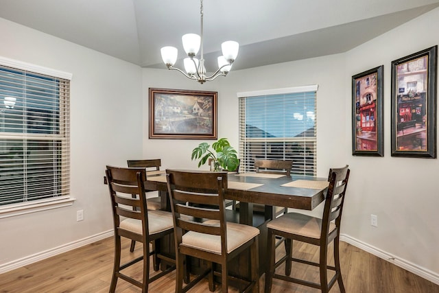 2065 Chief St, Bryan, TX 77807 - dining room featuring light wood-style floors, a chandelier, and baseboards