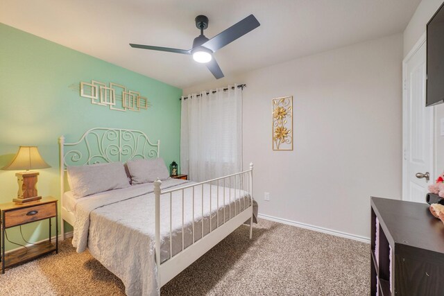 2065 Chief St, Bryan, TX 77807 - bedroom featuring carpet, baseboards, and a ceiling fan