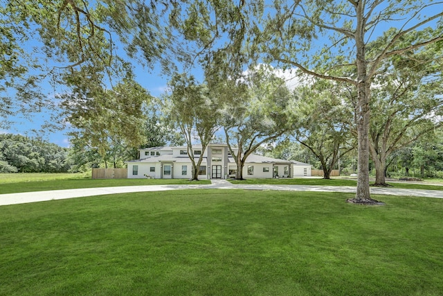 26511 Meadow Ln, Katy, TX 77494 - view of front facade with a front lawn and stucco siding