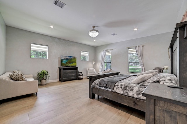 26511 Meadow Ln, Katy, TX 77494 - bedroom featuring light wood-type flooring, multiple windows, recessed lighting, and baseboards