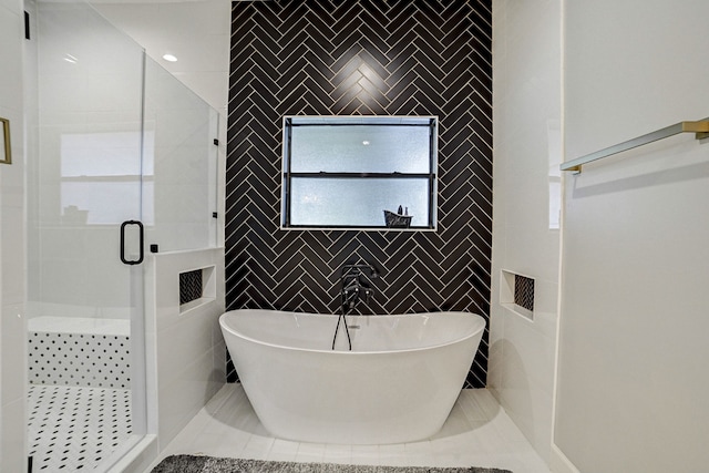 26511 Meadow Ln, Katy, TX 77494 - bathroom featuring tile walls, a stall shower, and a soaking tub