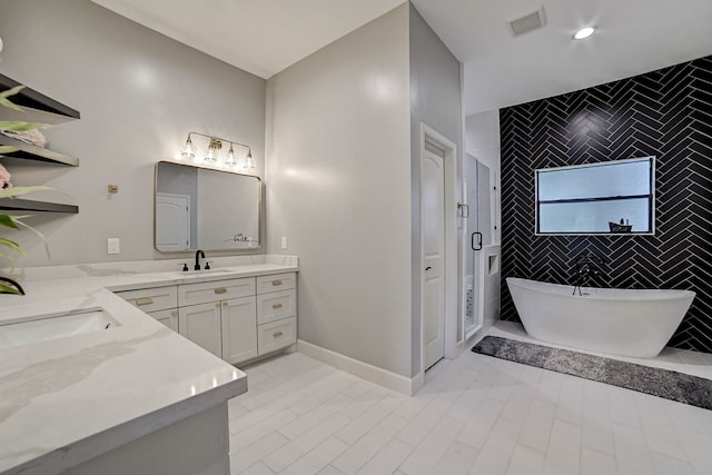 26511 Meadow Ln, Katy, TX 77494 - full bath with vanity, tile walls, a freestanding bath, an enclosed shower, and tile patterned flooring