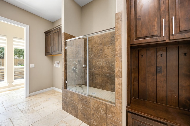 2911 S Saddlebrook Ln, Katy, TX 77494 - full bathroom with a tile shower and stone tile flooring