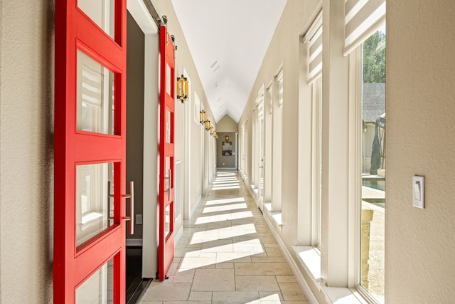 2911 S Saddlebrook Ln, Katy, TX 77494 - hall featuring stone tile floors and lofted ceiling