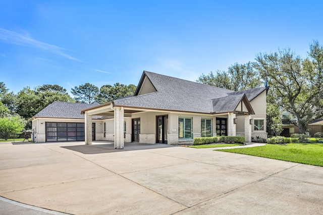 2911 S Saddlebrook Ln, Katy, TX 77494 - view of front of property with stucco siding, concrete driveway, a front lawn, and stone siding