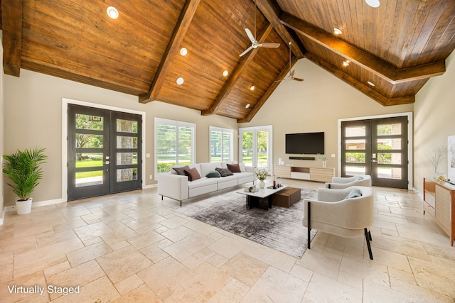 2911 S Saddlebrook Ln, Katy, TX 77494 - living area with french doors, a wood ceiling with exposed beams, stone tile floors, healthy amount of natural light, and a ceiling fan