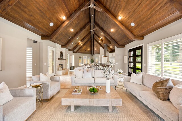 2911 S Saddlebrook Ln, Katy, TX 77494 - living room featuring a wood ceiling with exposed beams, recessed lighting, high vaulted ceiling, and ceiling fan
