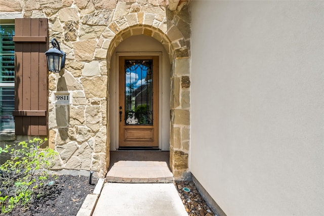 9811 Mount Shasta, Missouri City, TX 77459 - doorway to property with stone siding