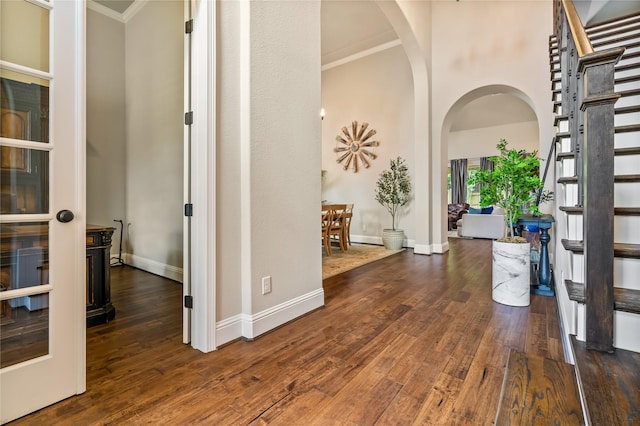 9811 Mount Shasta, Missouri City, TX 77459 - entrance foyer with arched walkways, stairway, ornamental molding, and wood finished floors