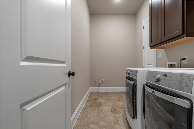 9811 Mount Shasta, Missouri City, TX 77459 - laundry area featuring cabinet space, independent washer and dryer, and stone finish floors