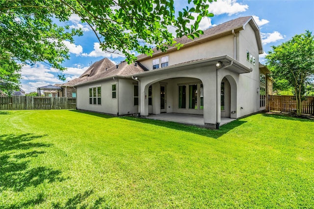9811 Mount Shasta, Missouri City, TX 77459 - rear view of house featuring stucco siding, a patio, and a fenced backyard