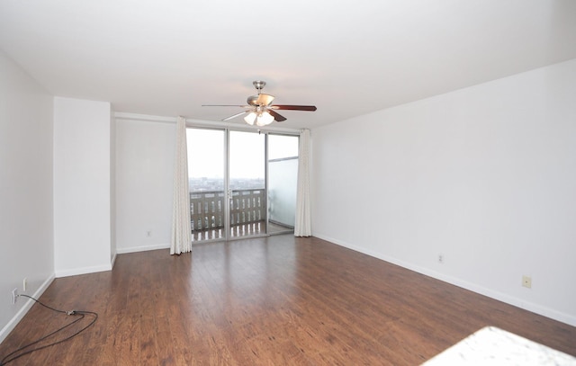 2016 Main St Unit 1208, Houston, TX 77002 - unfurnished room featuring a ceiling fan, wood finished floors, baseboards, and a wall of windows