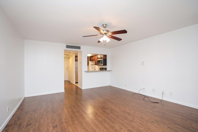 2016 Main St Unit 1208, Houston, TX 77002 - unfurnished living room featuring dark wood finished floors, ceiling fan, and baseboards