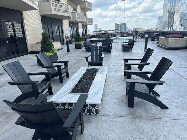 2016 Main St Unit 1208, Houston, TX 77002 - view of patio / terrace with an outdoor fire pit and a city view