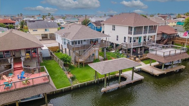 aerial perspective of suburban area with a nearby body of water