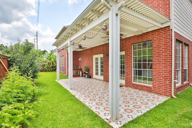 view of home's exterior featuring brick siding, a patio area, a yard, and a pergola