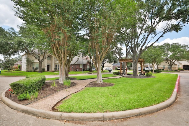 view of community with a yard and a gazebo
