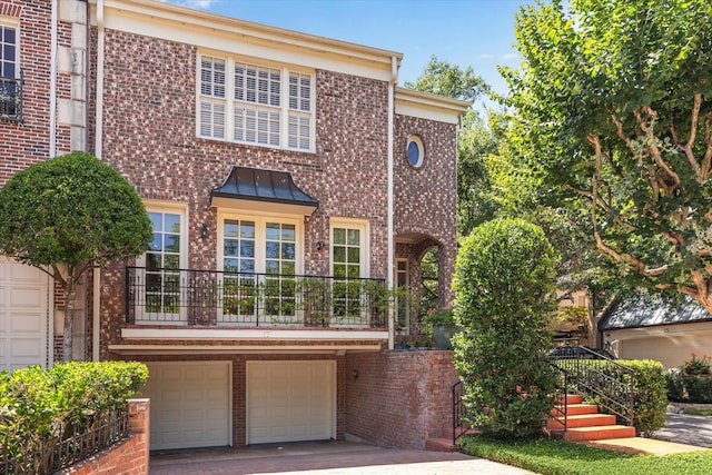 17 Pine Briar Cir, Houston, TX 77056 - view of front facade with brick siding, a garage, and concrete driveway