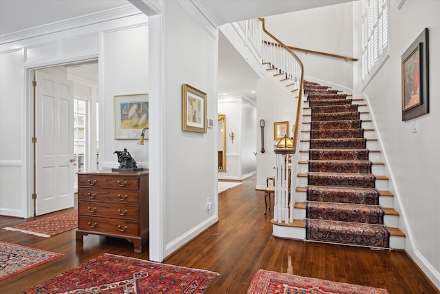 17 Pine Briar Cir, Houston, TX 77056 - foyer with dark wood-style flooring, stairs, baseboards, and ornamental molding