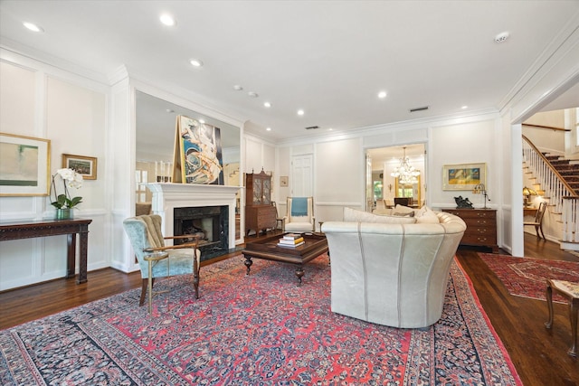 17 Pine Briar Cir, Houston, TX 77056 - living room with stairs, crown molding, wood finished floors, a premium fireplace, and a chandelier