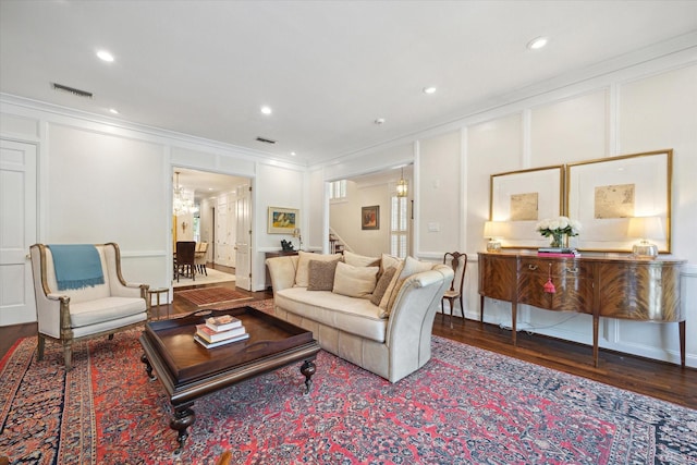 17 Pine Briar Cir, Houston, TX 77056 - living area featuring a decorative wall, ornamental molding, stairs, wood finished floors, and recessed lighting