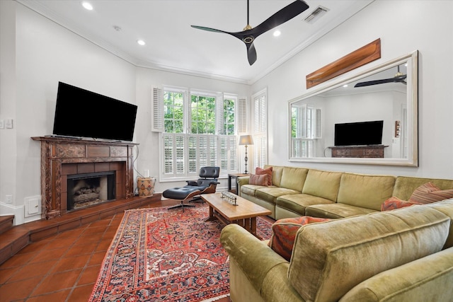 17 Pine Briar Cir, Houston, TX 77056 - tiled living room featuring ceiling fan, crown molding, a fireplace with raised hearth, and recessed lighting