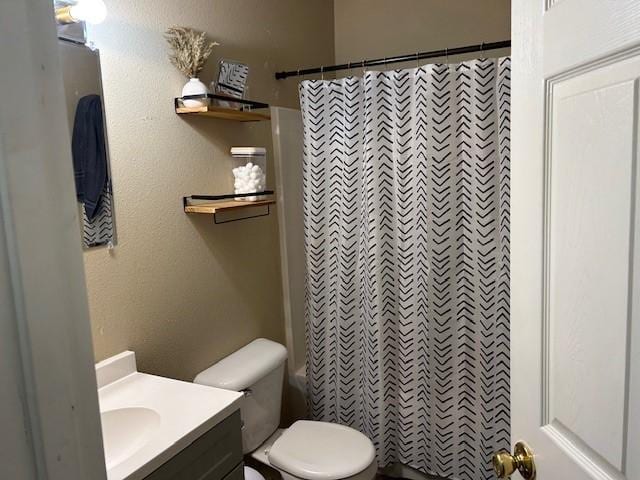 full bath with vanity, toilet, and shower / bathtub combination with curtain