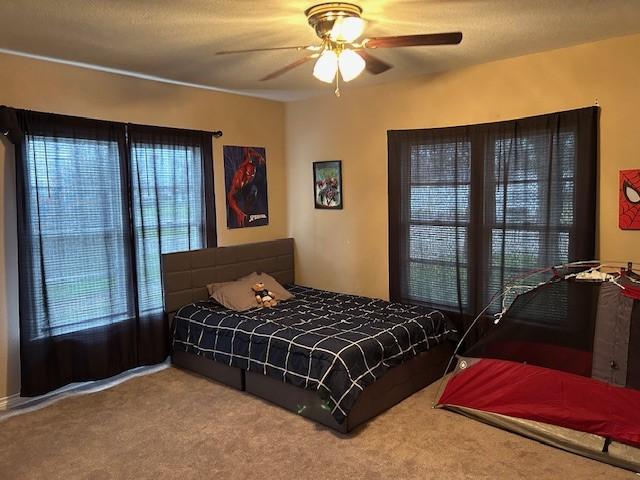 bedroom with carpet flooring and ceiling fan