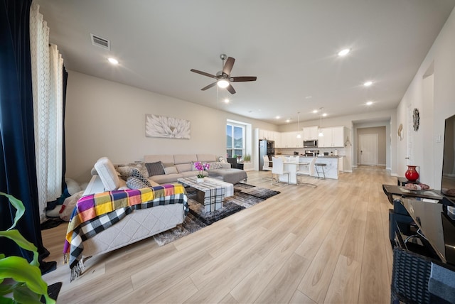 24323 Salts Mill Dr, Katy, TX 77493 - living area with a ceiling fan, light wood-style flooring, and recessed lighting