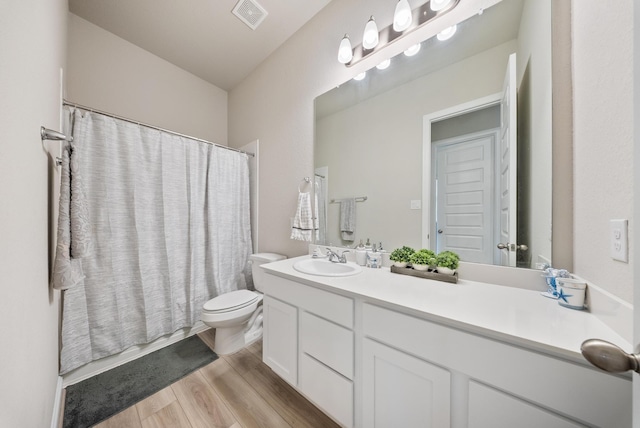 24323 Salts Mill Dr, Katy, TX 77493 - bathroom featuring wood finished floors, toilet, and vanity