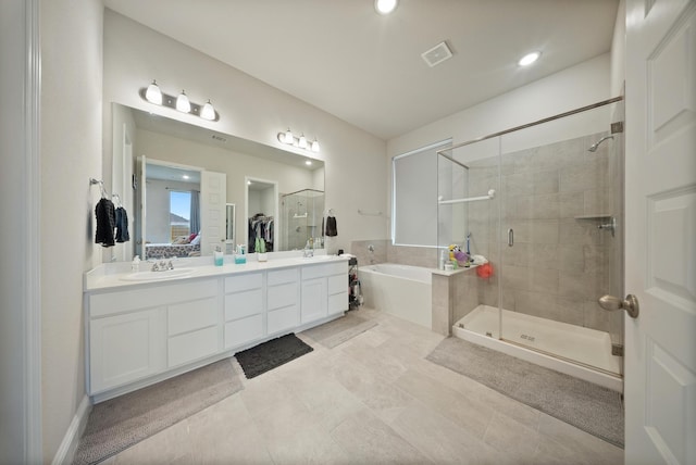 24323 Salts Mill Dr, Katy, TX 77493 - full bathroom with a bath, a stall shower, double vanity, and recessed lighting