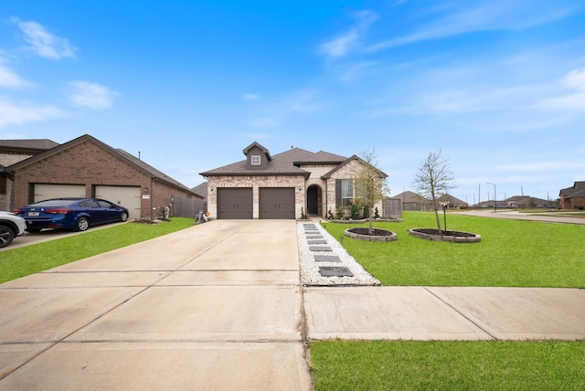 24323 Salts Mill Dr, Katy, TX 77493 - french provincial home with a garage, driveway, a front yard, stone siding, and brick siding