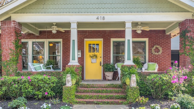 418 Byrne St, Houston, TX 77009 - doorway to property featuring ceiling fan, covered porch, and brick siding