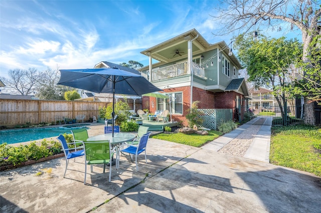 418 Byrne St, Houston, TX 77009 - view of patio with a balcony, ceiling fan, outdoor dining area, and a fenced backyard