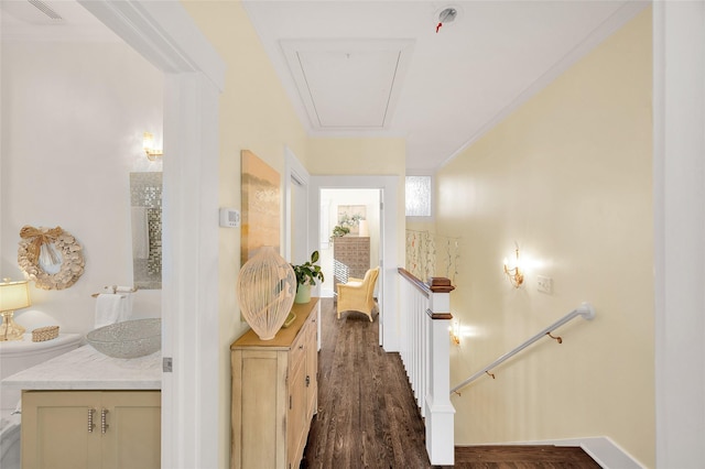 418 Byrne St, Houston, TX 77009 - hallway with an upstairs landing, attic access, dark wood finished floors, baseboards, and ornamental molding