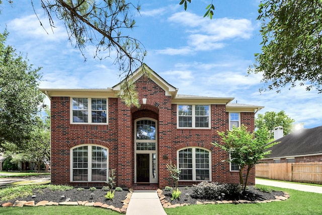 8742 Melting Shadows Ln, Houston, TX 77095 - view of front facade featuring fence and brick siding