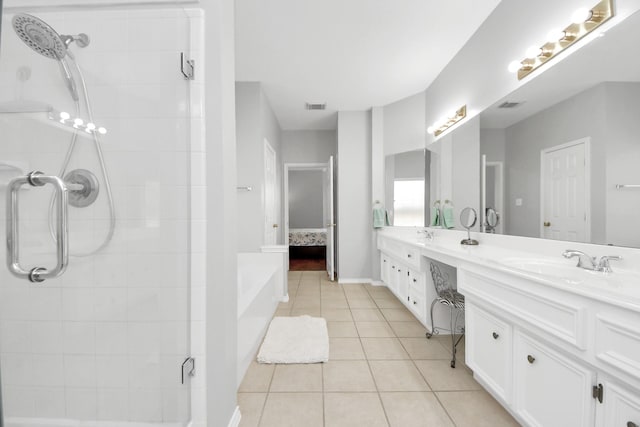 8742 Melting Shadows Ln, Houston, TX 77095 - ensuite bathroom featuring tile patterned floors, a tile shower, and double vanity