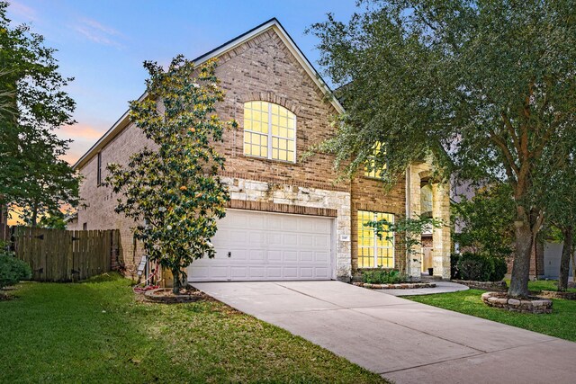 2107 Pearl Bay Ct, Pearland, TX 77584 - view of front of house with an attached garage, concrete driveway, and brick siding