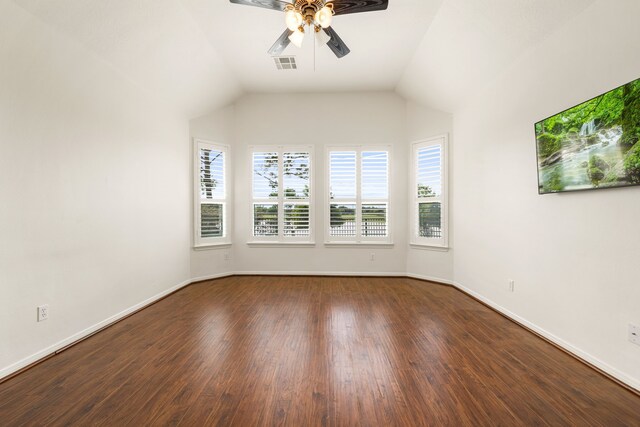 2107 Pearl Bay Ct, Pearland, TX 77584 - empty room with a ceiling fan, dark wood-style floors, baseboards, and vaulted ceiling