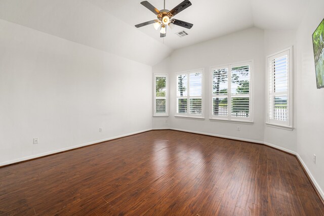 2107 Pearl Bay Ct, Pearland, TX 77584 - empty room with vaulted ceiling, a ceiling fan, dark wood-style flooring, and baseboards